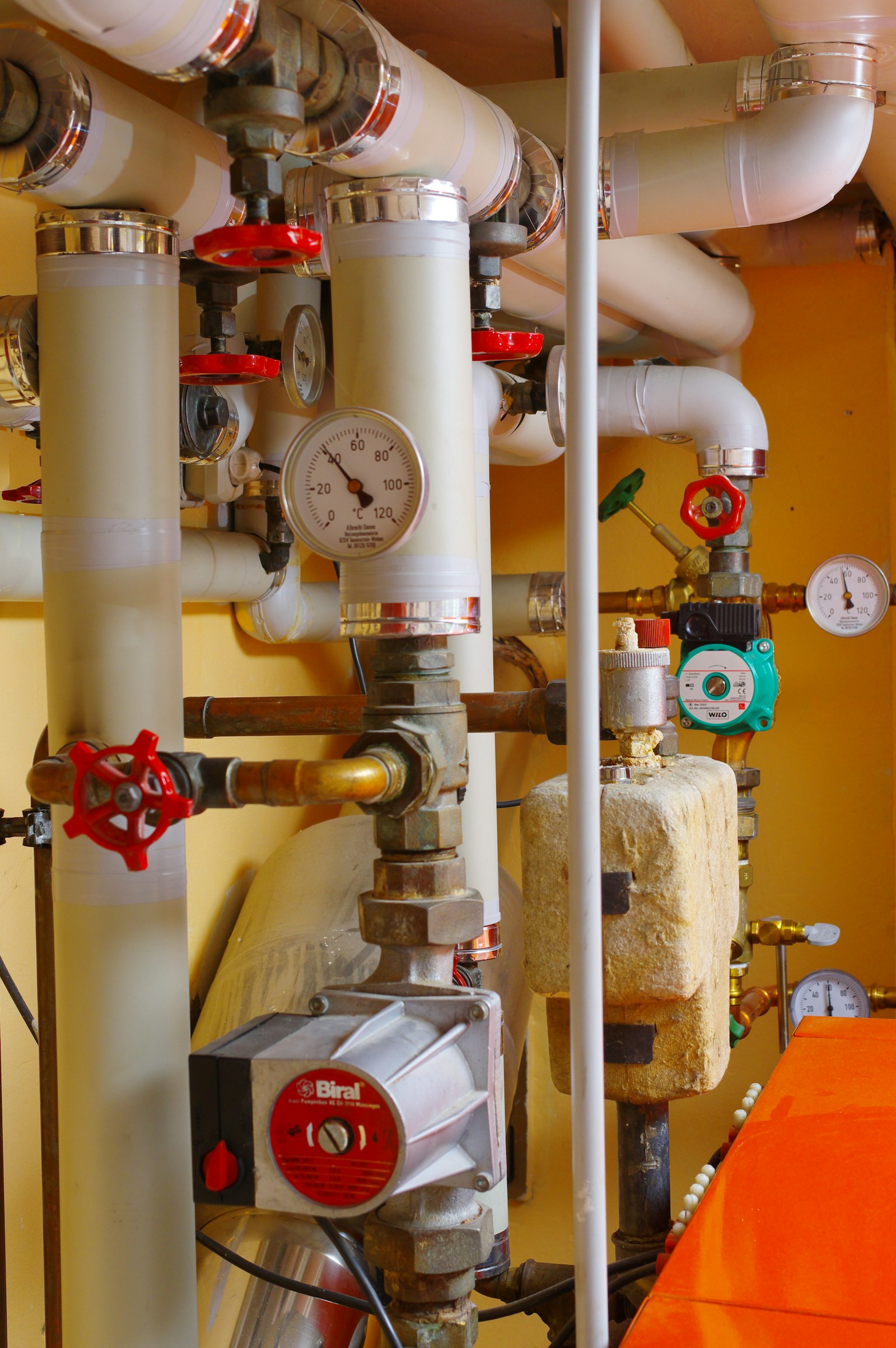 Insulated pipes, valves and gauges in a heating system.